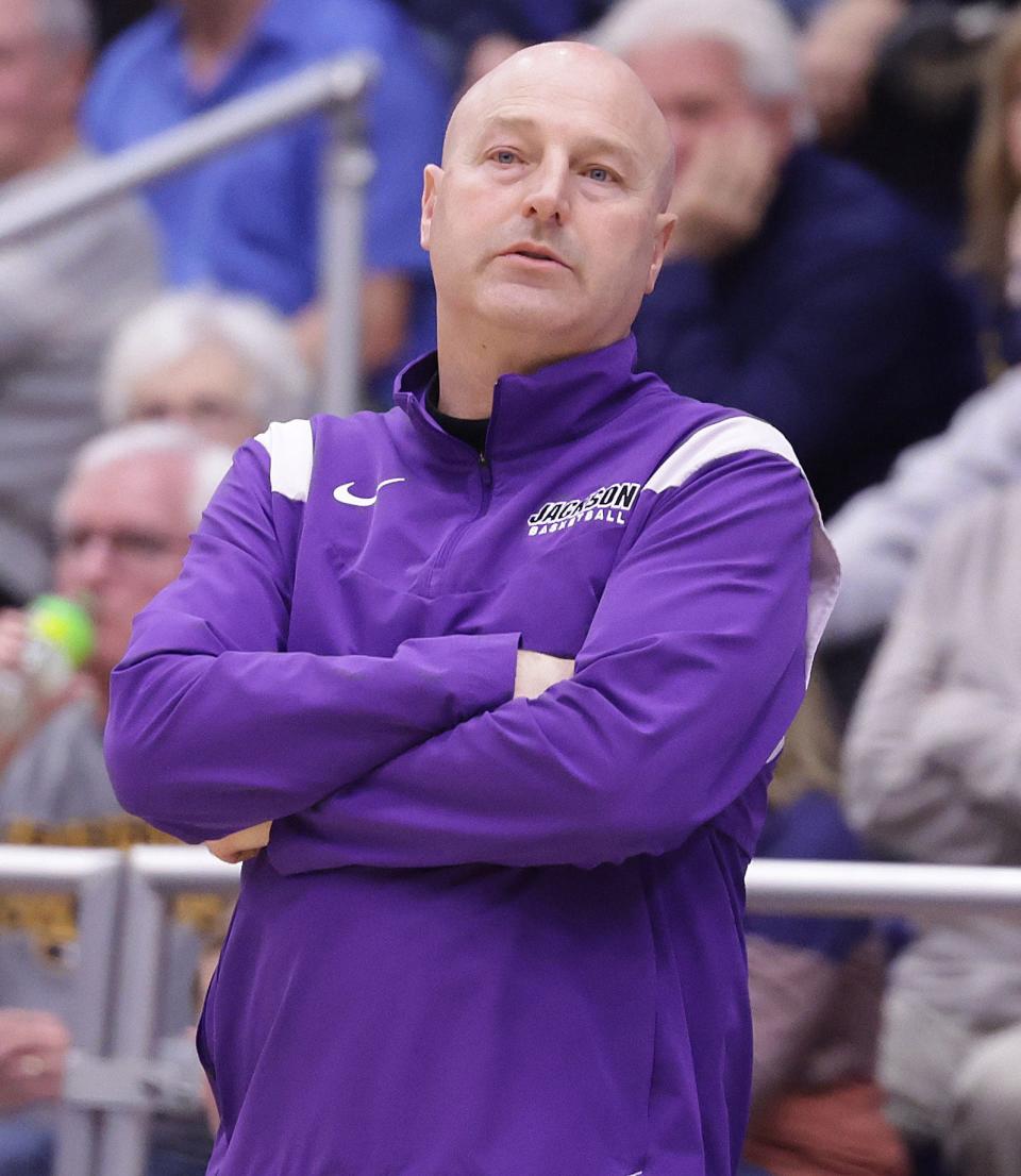Jackson boys basketball coach Tim Debevec watches his Polar Bears play Cleveland St. Ignatius in an OHSAA regional semifinal at Kent State, Wednesday, March 13, 2024.