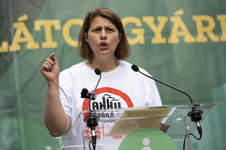 Eva Kozma speaks during a demonstration against a new factory to produce batteries for electric vehicles built by China-based Contemporary Amperex Technology Co. Limited (CATL) Tuesday, May 23, 2023, in Debrecen, Hungary. "This is progress, this is the future? Pouring concrete over nature while we know how polluting the factory is going to be?" she said. (AP Photo/Denes Erdos)