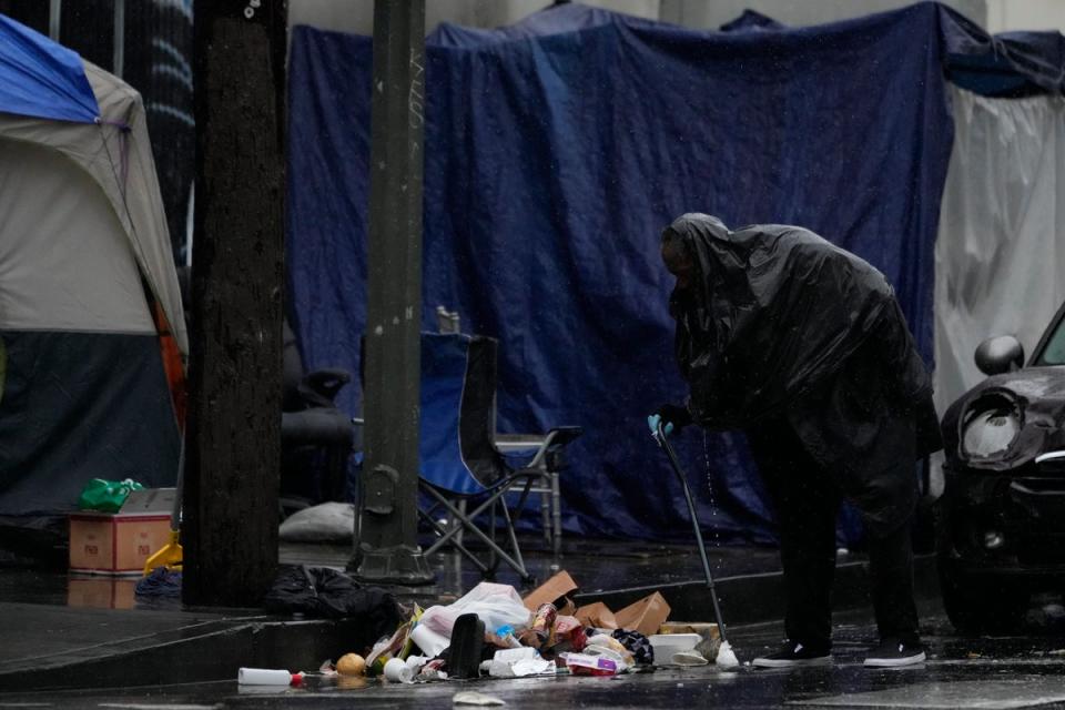 The severe California storms in previous days have hit LA’s unhoused population hardest (AP)