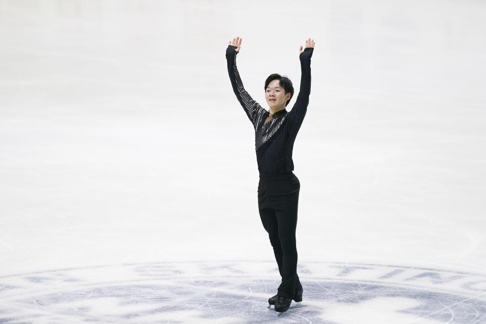 Yuma Kagiyama of Latvia waves after performing in the men's short program during the ISU Grand Prix of Figure Skating - NHK Trophy in Kadoma, near Osaka, Japan, Friday, Nov. 24, 2023. (AP Photo/Tomohiro Ohsumi)