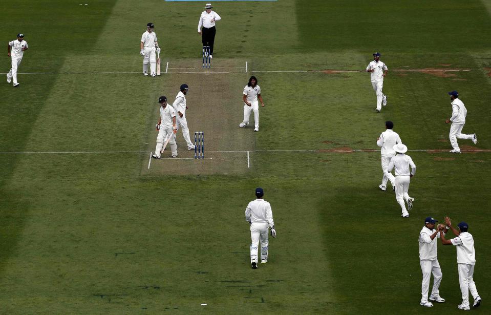 India's Ishant Sharma (C) celebrates his fifth wicket against New Zealand's BJ Watling during day one of the second international test cricket match at the Basin Reserve in Wellington, February 14, 2014.