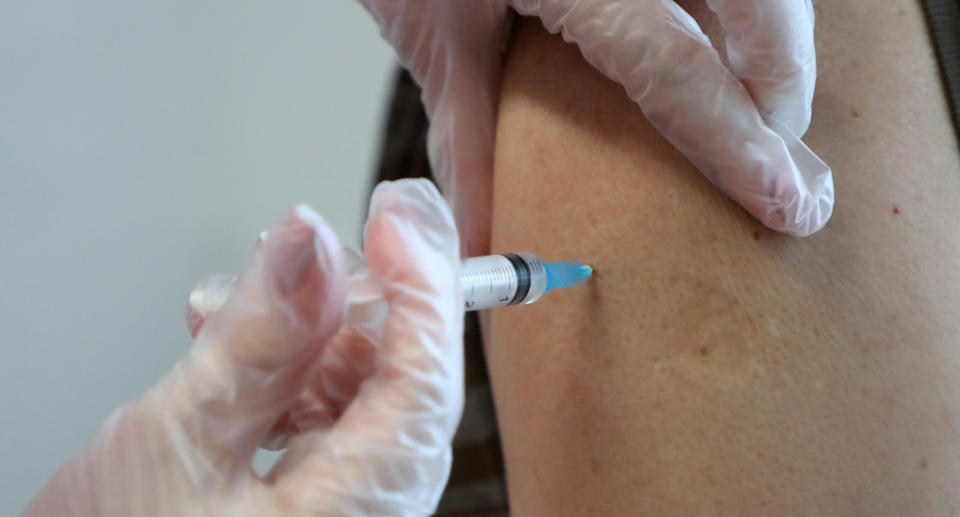 A person receives a vaccine.