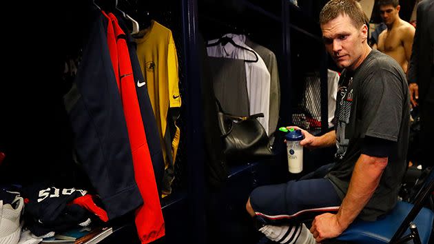 Brady frantically searches for the jersey. Image: Getty