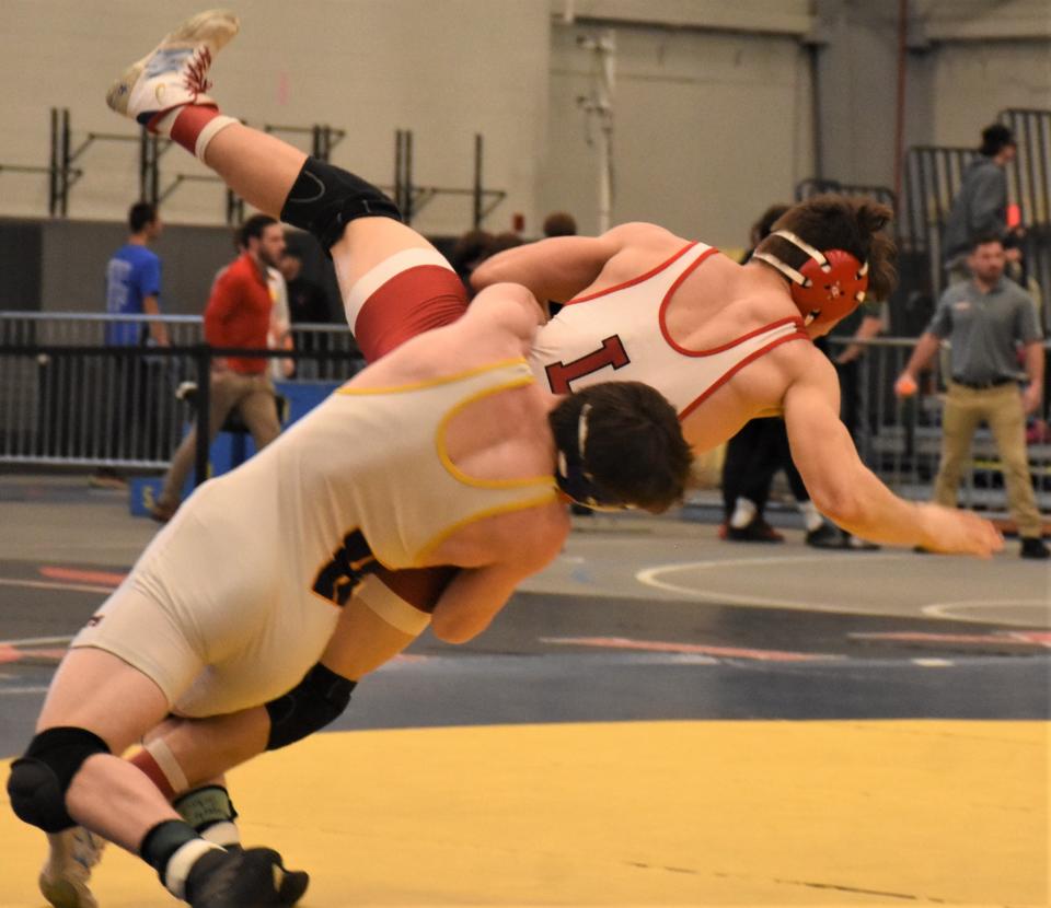 Holland Patent Golden Knight Jordan Koenig throws Lowville Academy's Sean Kelly to the mat during Division II's 172-pound final at the Section III championship meet Feb. 11 at SRC Arena. Koenig enters the state tournament this weekend as a No. 1 seed.