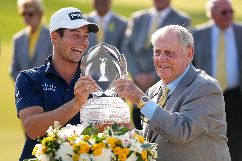 June 4, 2023; Dublin, Ohio, USA;  Viktor Hovland receives the trophy from Jack Nicklaus after winning in a playoff over Denny McCarthy during the final round of the Memorial Tournament at Muirfield Village Golf Club. 