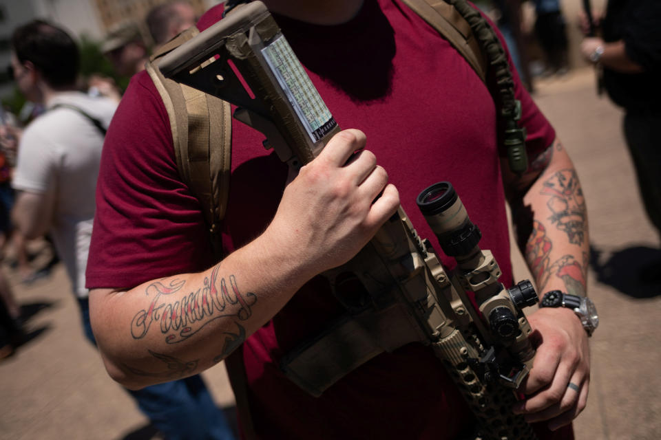 David Rohwer of Austin holds his assault rifle during an open carry firearm rally on the sidelines of the annual National Rifle Association (NRA) meeting in Dallas, Texas, U.S., May 5, 2018. REUTERS/Adrees Latif