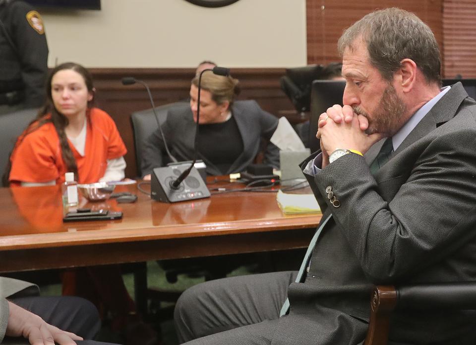 Assistant Summit County Prosecutor Brian LoPrinzi waits for Judge Jennifer Towell to return with a sentence for Erica Stefanko, far left, on Thursday in Akron. Stefanko was sentenced to life in prison with a possible parole after 30 years for her role in the 2012 murder of Ashley Biggs.