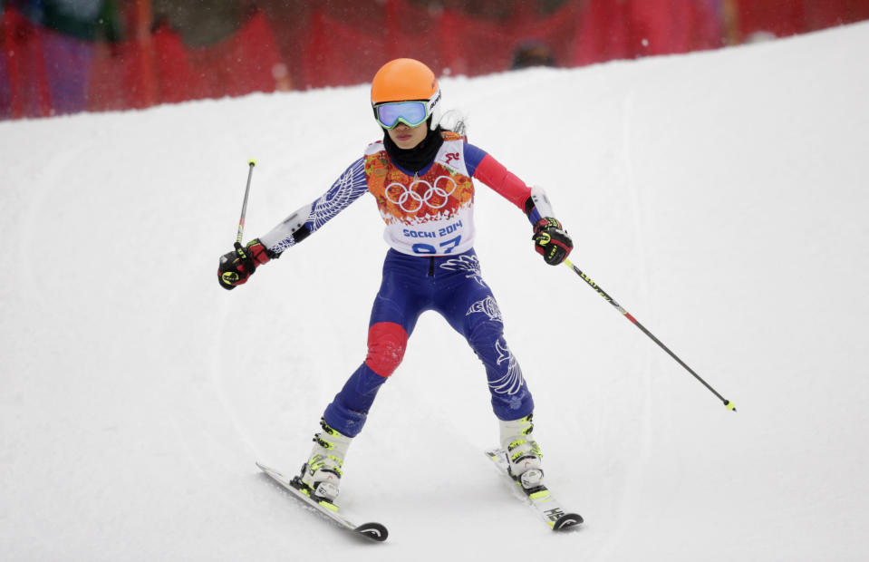 Violinst Vanessa Mae, starting under her father's name as Vanessa Vanakorn for Thailand, competes in the first run of the women's giant slalom at the Sochi 2014 Winter Olympics, Tuesday, Feb. 18, 2014, in Krasnaya Polyana, Russia. (AP Photo/Charles Krupa)