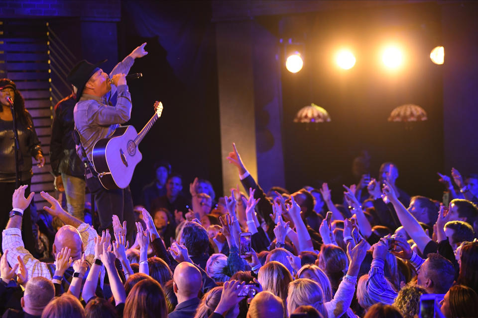 FILE - In this Nov. 13, 2019, file photo, Garth Brooks performs "Dive Bar" at the 53rd annual CMA Awards at Bridgestone Arena in Nashville, Tenn. Add Garth Brooks to the lineup of entertainers at the inauguration of President-elect Joe Biden. Brooks, who joins Lady Gaga and Jennifer Lopez among others, performed during the inaugural celebration of President Barack Obama in 2009. He turned down a chance to play for President Donald Trump in 2017, citing a scheduling conflict. (AP Photo/Mark J. Terrill, File)