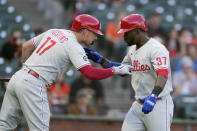 Philadelphia Phillies' Odubel Herrera (37) is congratulated by Rhys Hoskins (17) after hitting a solo home run against the San Francisco Giants during the first inning of a baseball game Friday, June 18, 2021, in San Francisco. (AP Photo/Tony Avelar)