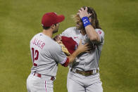 Philadelphia Phillies' Bryce Harper, right, reacts alongside Neil Walker (12) after being thrown out of the baseball game against the New York Mets by umpire Roberto Ortiz during the fifth inning Saturday, Sept. 5, 2020, in New York. (AP Photo/John Minchillo)