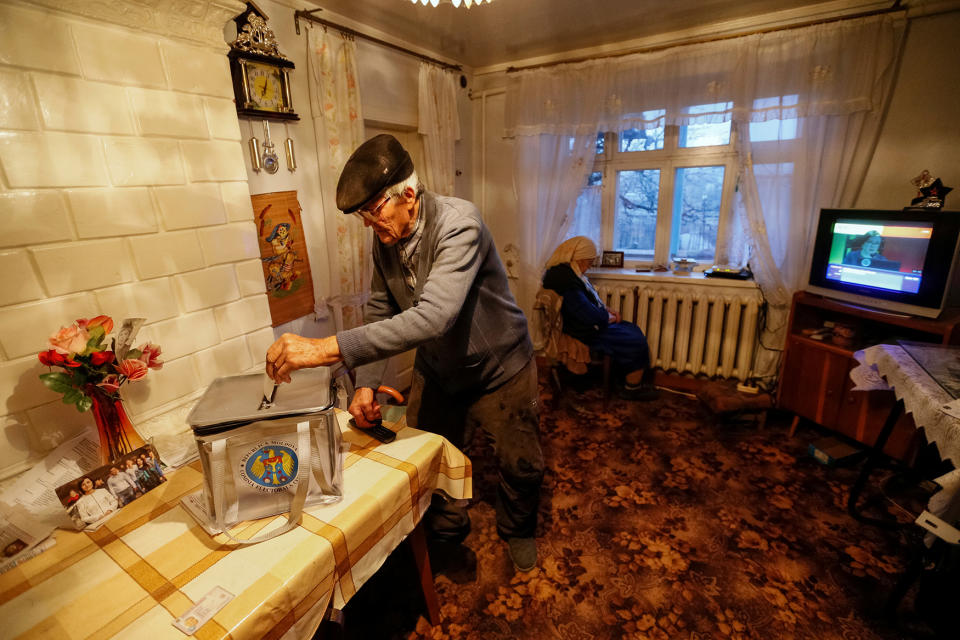 A local resident casts his ballot in Suruceni