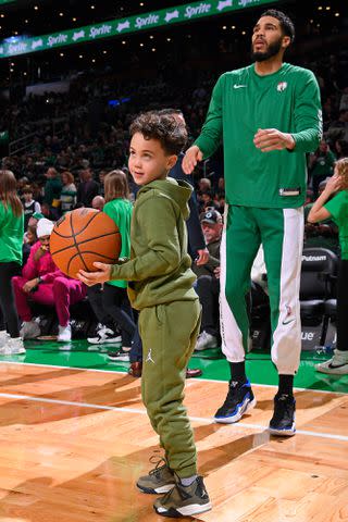 <p>Brian Babineau/NBAE via Getty </p> Jayson Tatum (right) and his son Deuce at the Dec. 15, 2023, Celtics game in Boston