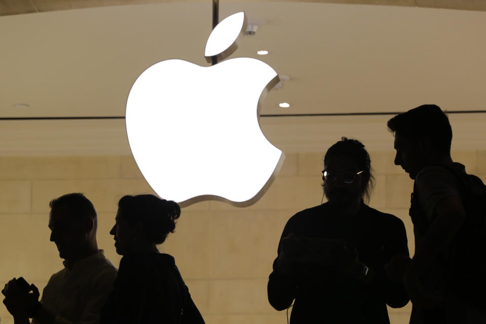 FILE – In this May 31, 2018, file photo, customers enter the Apple store, in New York. Apple will build a $1 billion campus in Austin, Texas, break ground on smaller locations in Seattle, San Diego and Culver City, California, and over the next three years will expand in Pittsburgh, New York and Colorado. (AP Photo/Mark Lennihan, File)