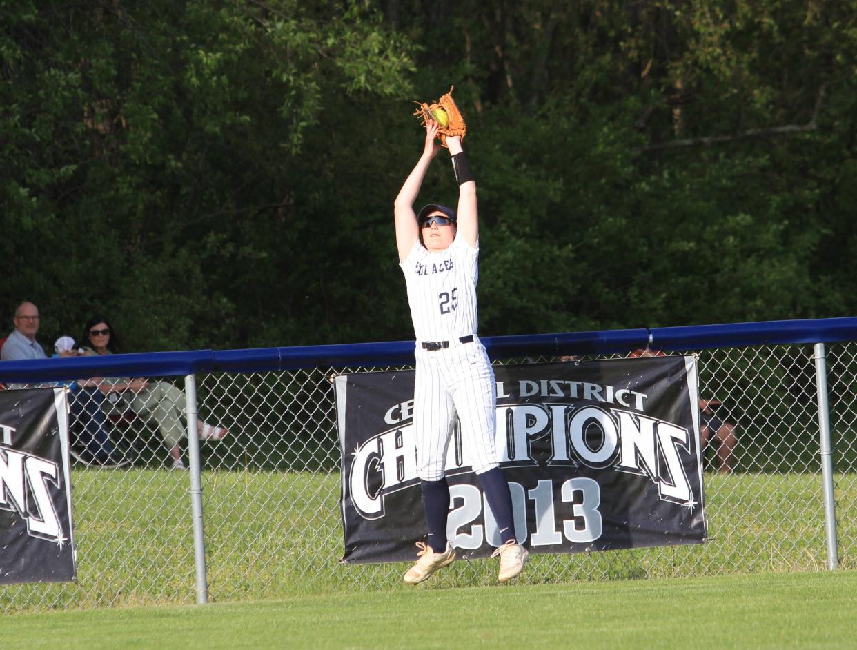 Granville's Megan Lodge makes a leaping catch in center field against Watkins Memorial on Monday.