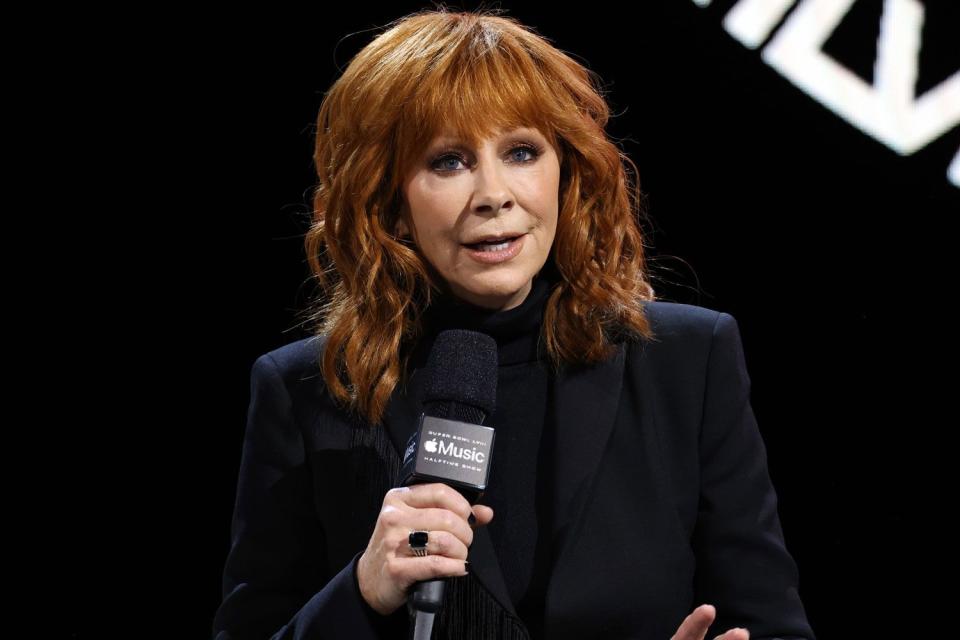 <p>Kevin Mazur/Getty</p> Reba McEntire at the Super Bowl LVIII Halftime Show press conference