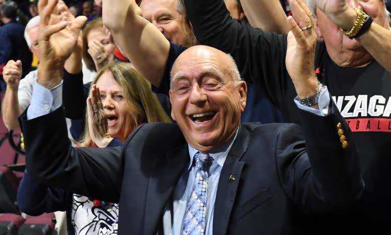 Dick Vitale celebrating with fans.