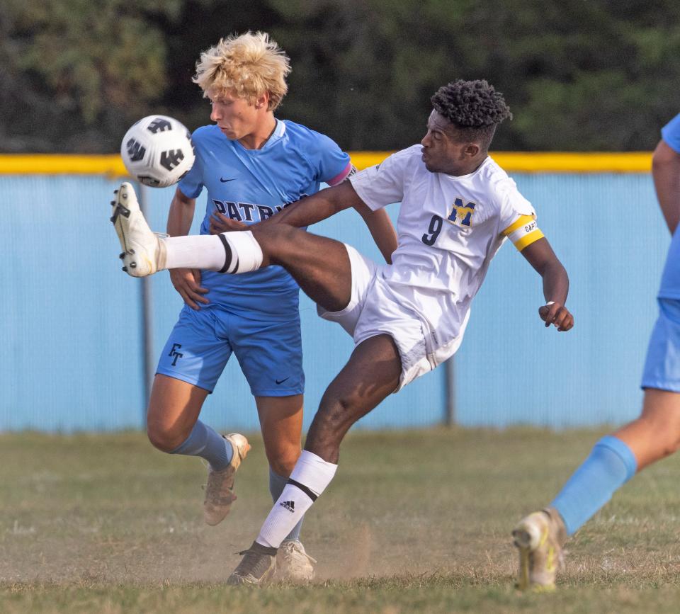 Marlboro Miles Richardson and Freehold Noah Jones battle for ball in first half action. Freehold Township Boys Soccer defeats Marlboro 2-0 in Freehold Township on September  29, 2022. 