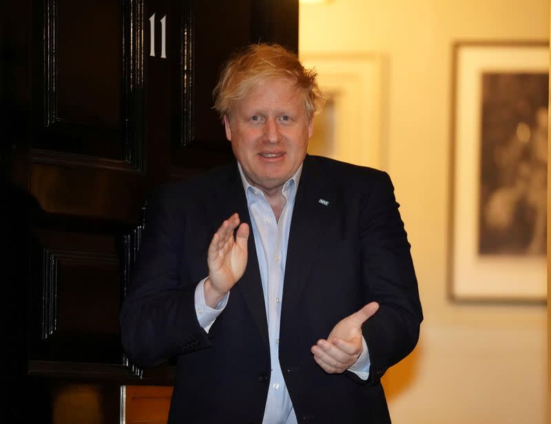 Britain's PM Johnson applauds in support of NHS outside 11 Downing, London