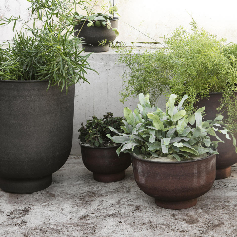 <p> 'In a small space, a few large features are better than many small ones. Two or three big pots will have much more impact and look far more stylish than a dozen ill-assorted smaller ones,' says gardening expert and TV personality Alan Titchmarsh. Potting your herbs in a few large, beautiful pots will always look nicer than using lots of tiny ones.  </p>