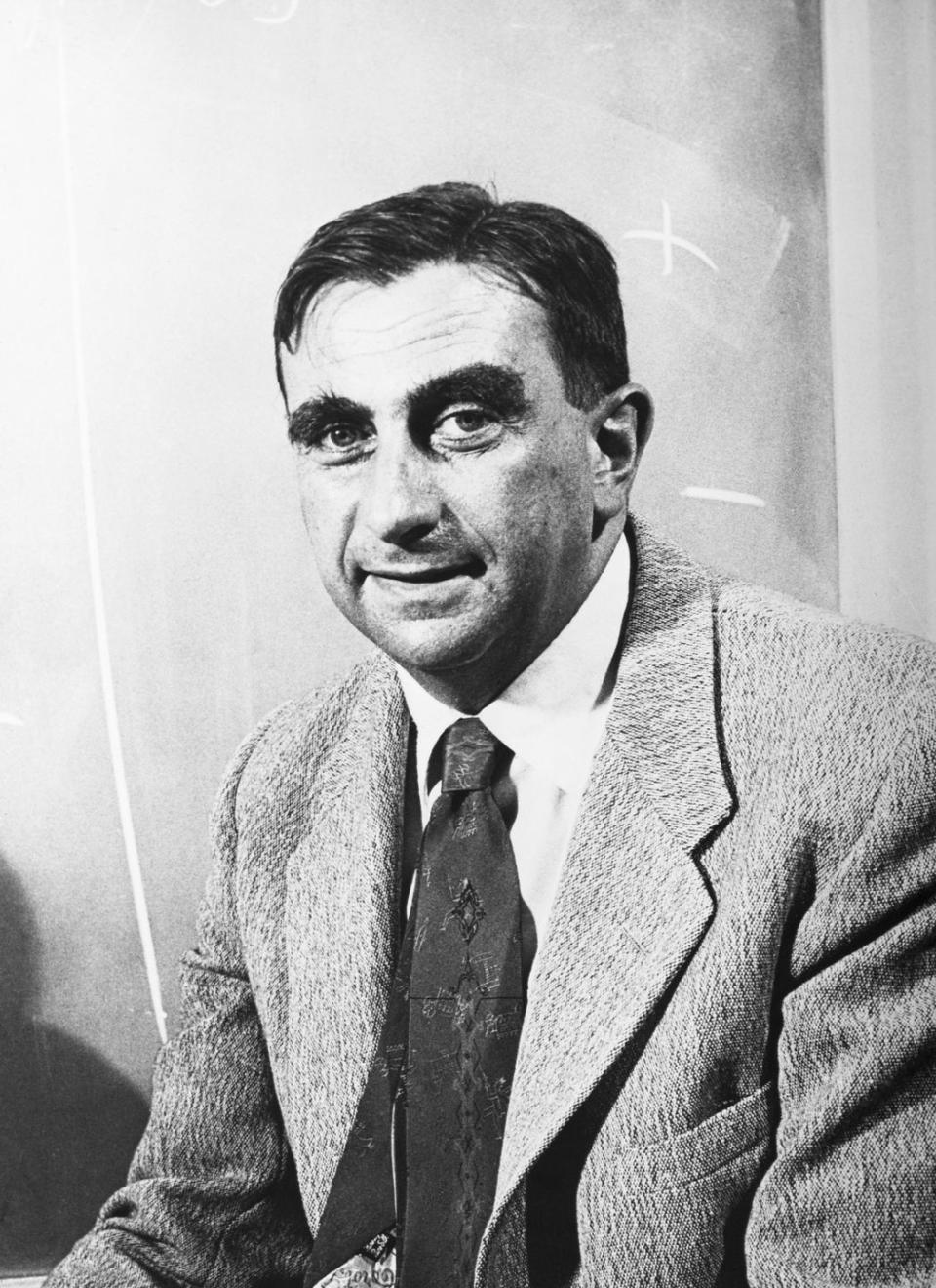 edward teller smiles at the camera, he wears a suit jacket and tie with a collared shirt