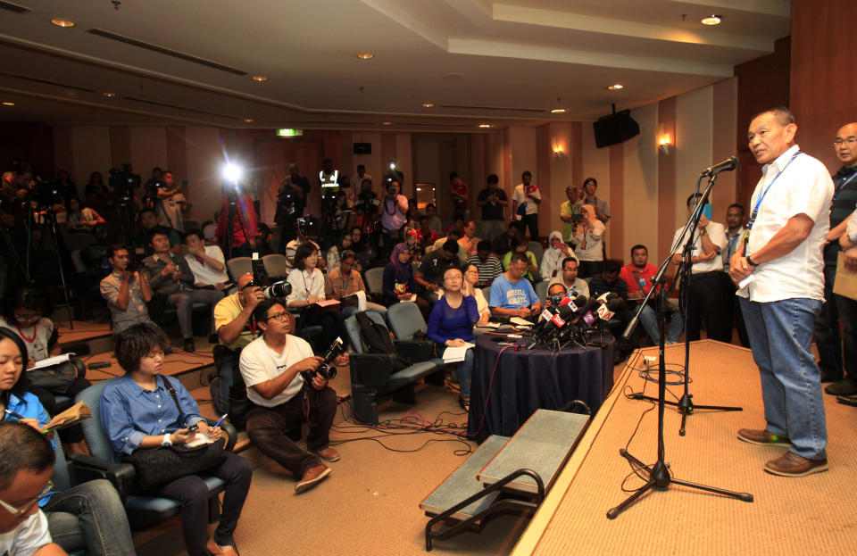 Malaysian Airlines Group Chief Executive Ahmad Jauhari Yahyain, right, speaks during a press conference at a hotel in Sepang, outside Kuala Lumpur, Malaysia, Saturday, March 8, 2014. A Malaysia Airlines Boeing 777-200 carrying 239 people lost contact with air traffic control early Saturday morning on a flight from Kuala Lumpur to Beijing, and international aviation authorities still hadn't located the jetliner several hours later. (AP Photo/Lai Seng Sin)