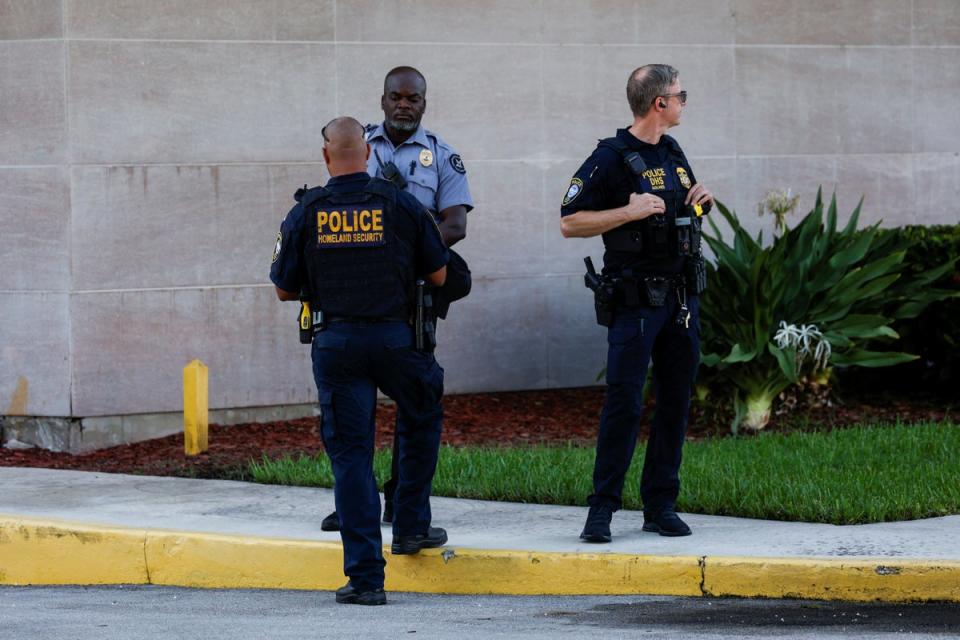 Police officers stand outside a federal building in Palm Beach, Florida, before Routh’s first appearance on Monday (REUTERS)