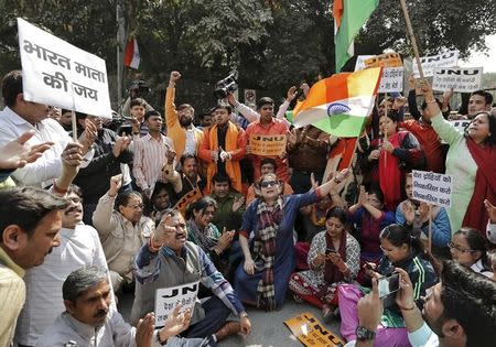 Activists from various Hindu right-wing groups shout slogans during a protest against the students of Jawaharlal Nehru University (JNU) outside the university campus in New Delhi, India, February 16, 2016. REUTERS/Anindito Mukherjee