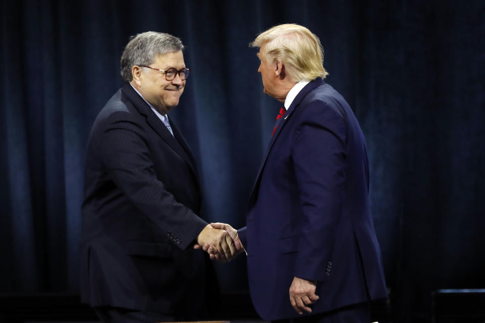 FILE - In this Oct. 28, 2019, file photo, President Donald Trump shakes hands with Attorney General William Barr before Trump signed an executive order creating a commission to study law enforcement and justice at the International Association of Chiefs of Police Convention in Chicago. Attorney General William Barr took a public swipe Thursday at President Donald Trump, saying that the president’s tweets about Justice Department prosecutors and cases “make it impossible for me to do my job.” Barr made the comment during an interview with ABC News just days after the Justice Department overruled its own prosecutors. they had initially recommended in a court filing that President Donald Trump’s longtime ally and confidant Roger Stone be sentenced to 7 to 9 years in prison. But the next day, the Justice Department took the extraordinary step of lowering the amount of prison time it would seek for Stone. (AP Photo/Charles Rex Arbogast, File)