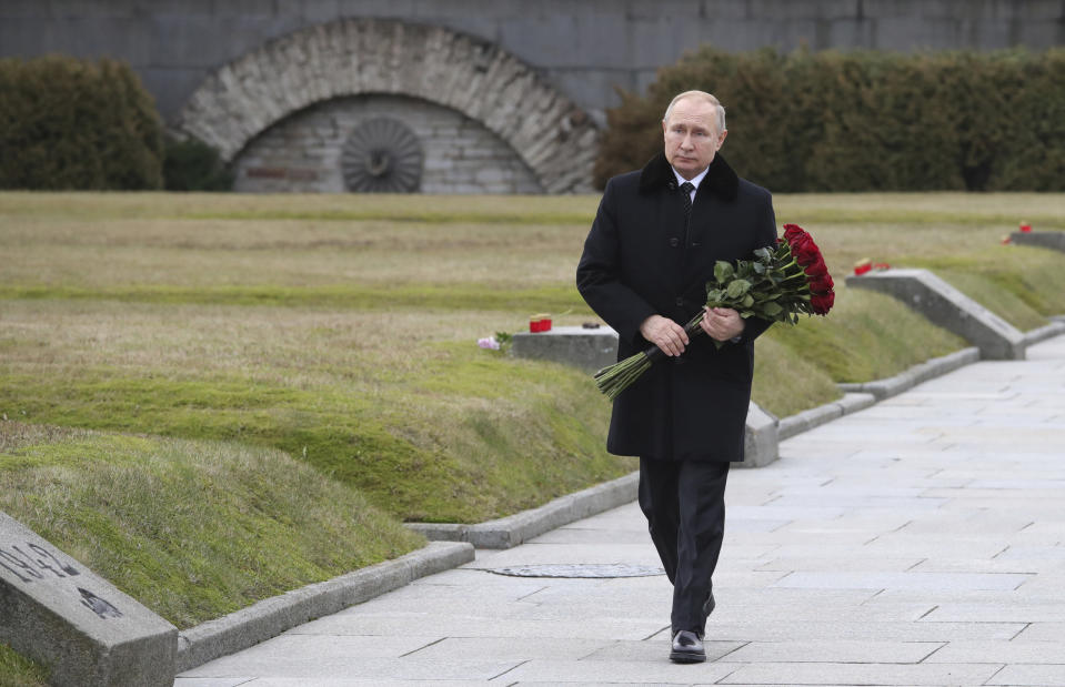 President Vladimir Putin attends a wreath laying commemoration ceremony for the 77th anniversary since the Leningrad siege was lifted during the World War Two at the Piskaryovskoye Memorial Cemetery, where hundreds of thousands of siege victims are buried, in St.Petersburg, Russia, Saturday, Jan. 18, 2020. (Alexei Danichev, Sputnik, Kremlin Pool Photo via AP)