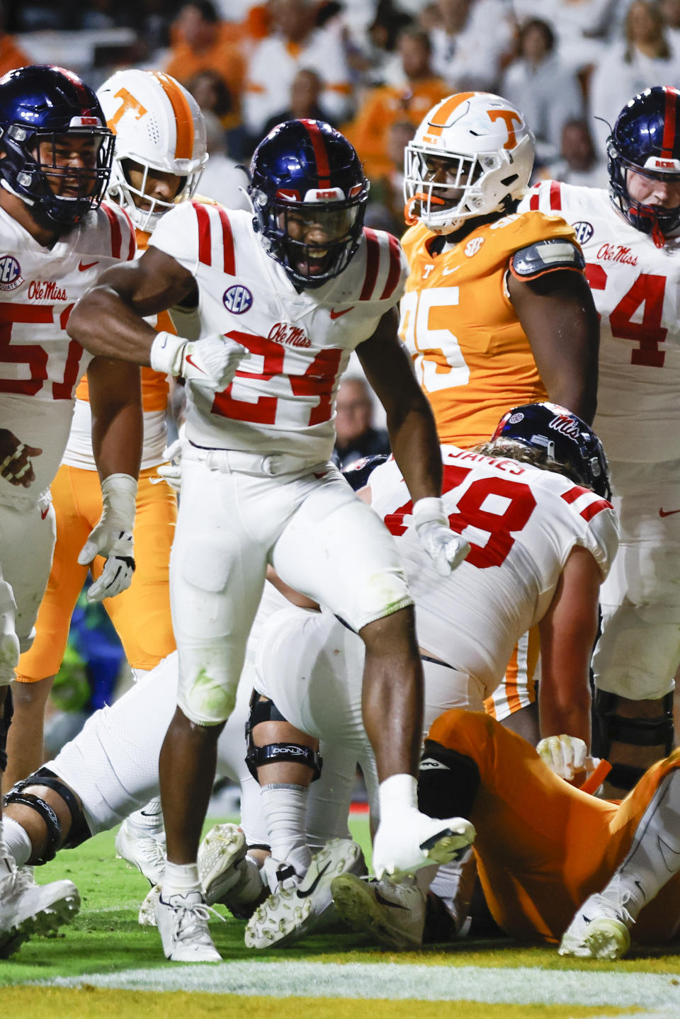 Mississippi running back Snoop Conner (24) reacts after his touchdown during the first half of an NCAA college football game against Tennessee on Saturday, Oct. 16, 2021, in Knoxville, Tenn. (AP Photo/Wade Payne)