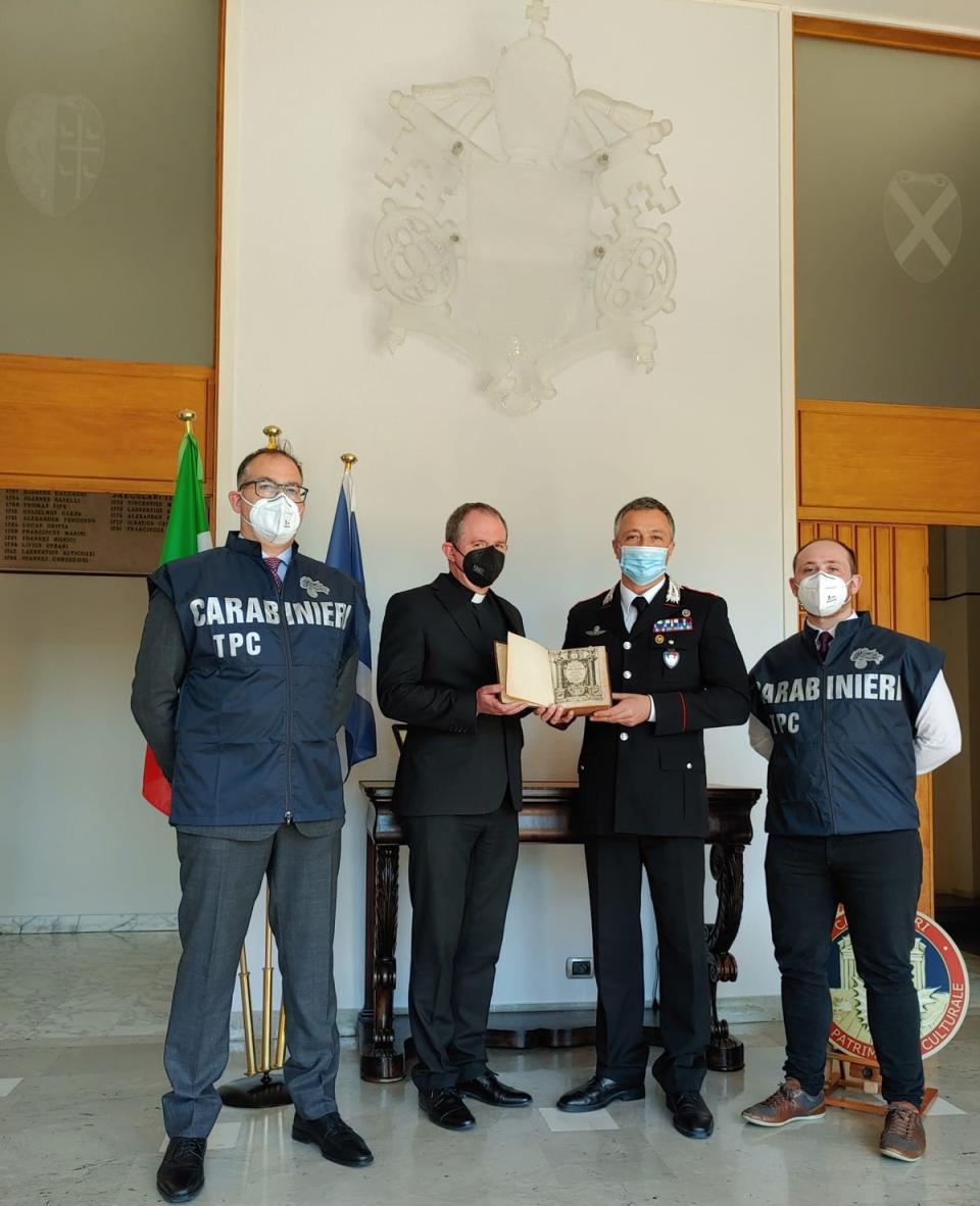 Officers from the Carabinieri returned the book to the Scots College in Rome, before it was then brought back to Scotland (Police Scotland/PA)