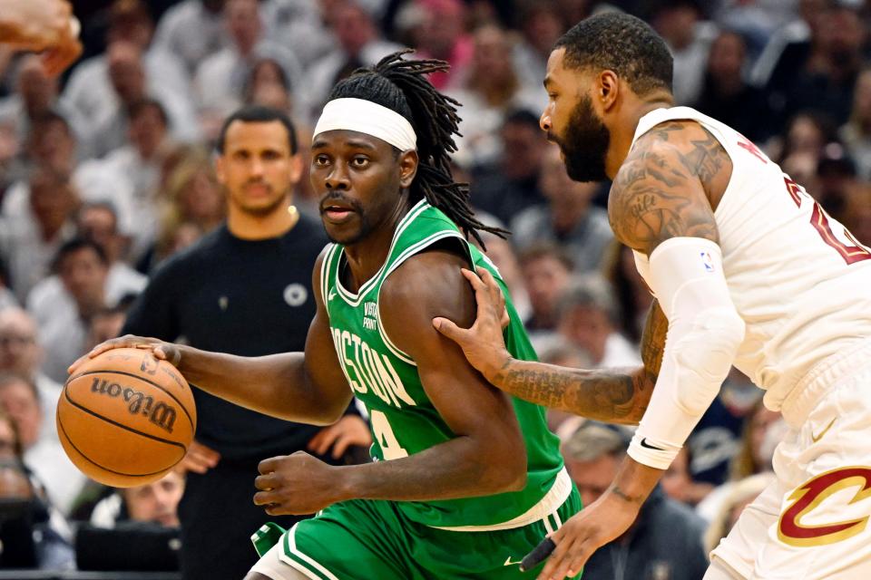 Celtics guard Jrue Holiday (4) dribbles the ball against Cavaliers forward Marcus Morris Sr. (24) in the second quarter of Game 3 of the Eastern Conference semifinals, May 11, 2024, in Cleveland.