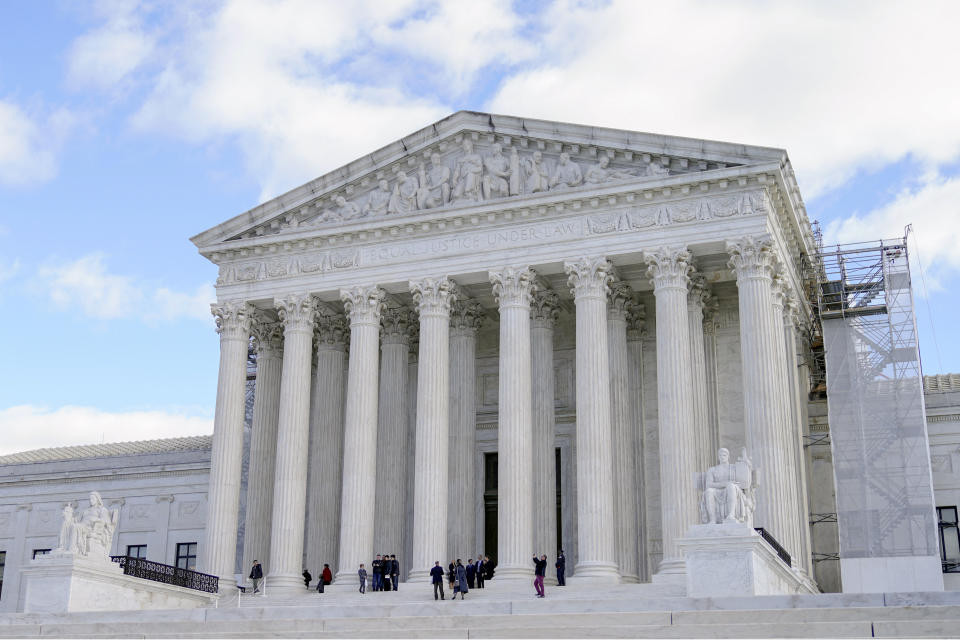 People leave after paying respects to retired Supreme Court Justice Sandra Day O'Connor, who is lying in repose at the Supreme Court in Washington, Monday, Dec. 18, 2023. O'Connor, an Arizona native and the first woman to serve on the nation's highest court, died Dec. 1 at age 93. (AP Photo/Mariam Zuhaib)