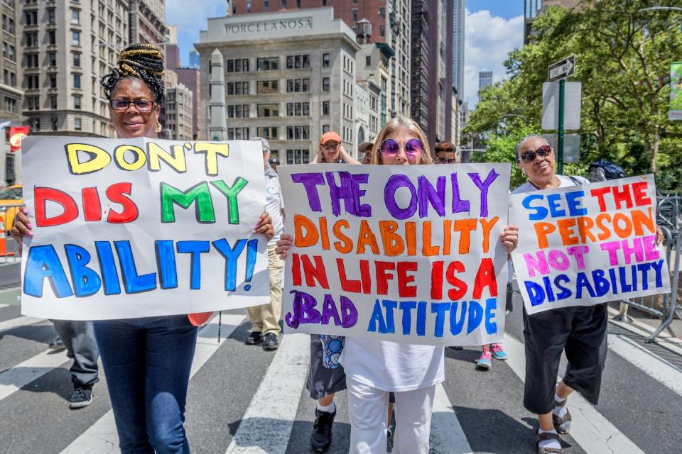 People celebrate the fifth annual Disability Pride March in New York in 2019. <a href="https://media.gettyimages.com/id/1229016168/photo/new-york-celebrated-the-fifth-annual-disability-pride-with-a.jpg?s=1024x1024&w=gi&k=20&c=M6hH6x0cDWSUvA2kbd1Nl-OkR6ijIBTzmVXUycpmQm4=" rel="nofollow noopener" target="_blank" data-ylk="slk:Erik McGregor/LightRocket via Getty Images;elm:context_link;itc:0;sec:content-canvas" class="link ">Erik McGregor/LightRocket via Getty Images</a>