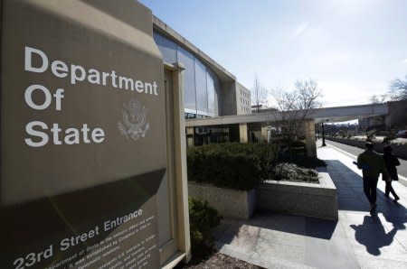 FILE PHOTO - People enter the State Department Building in Washington, U.S., January 26, 2017. REUTERS/Joshua Roberts