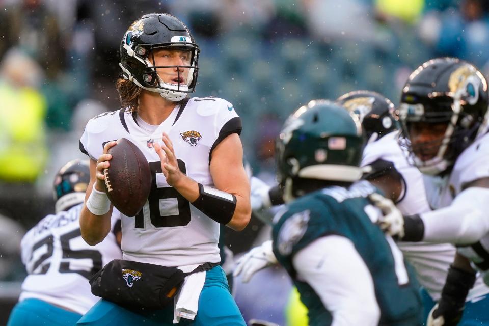 Jacksonville Jaguars' Trevor Lawrence looks to pass during the second half of an NFL football game against the Philadelphia Eagles on Sunday, Oct. 2, 2022, in Philadelphia. (AP Photo/Matt Rourke)