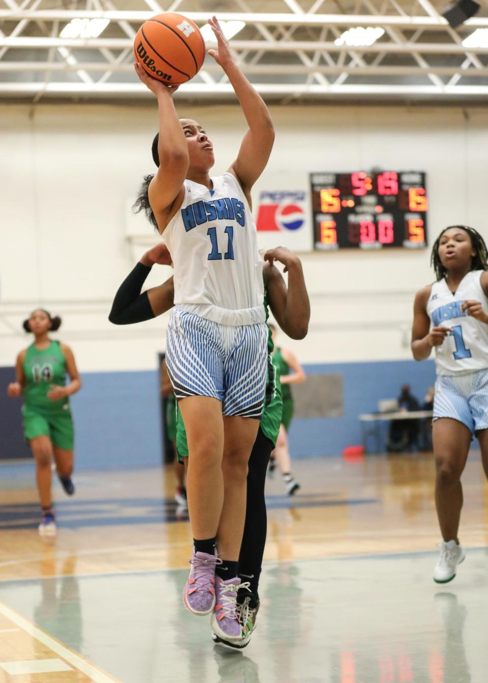 Hunter Huss' Myla Hoover goes up for a shot during her team's matchup with rival Ashbrook earlier this winter.