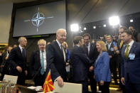 FILE - US President Joe Biden, center, arrives for a round table meeting during an extraordinary NATO summit at NATO headquarters in Brussels, Thursday, March 24, 2022. Seven decades after it was founded, the North Atlantic Treaty Organization is meeting in Madrid on June 29 and 30, 2022 with an urgent need to reassert its original mission: preventing Russian aggression against Western allies. (AP Photo/Markus Schreiber, File)