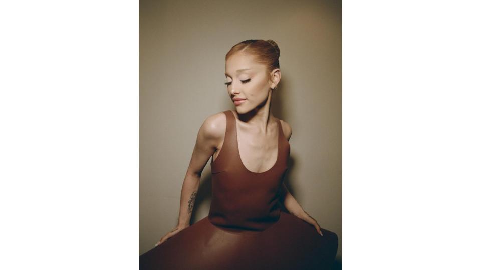 Ariana Grande poses for an Instagram pic in a brown JW Anderson dress