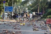 Protesters attempt to leave the campus of Hong Kong Polytechnic University (PolyU) and avoid getting detain during clashes with police in Hong Kong