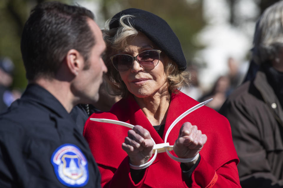 Actress Jane Fonda gestures after being arrested during a rally on Capitol Hill in Washington, Friday, Oct. 18, 2019. A half-century after throwing her attention-getting celebrity status into Vietnam War protests, 81-year-old Jane Fonda is now doing the same in a U.S. climate movement where the average age is 18. (AP Photo/Manuel Balce Ceneta)