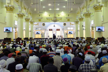 Muslims attend Friday prayers at the Muhammadi Mosque in Kota Bharu, Kelantan, Malaysia on April 13, 2018. REUTERS/Stringer