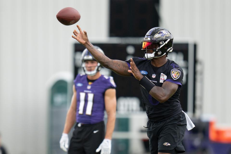 Baltimore Ravens quarterback Lamar Jackson (8) throws the ball during day one of training camp at Under Armour Performance Center.