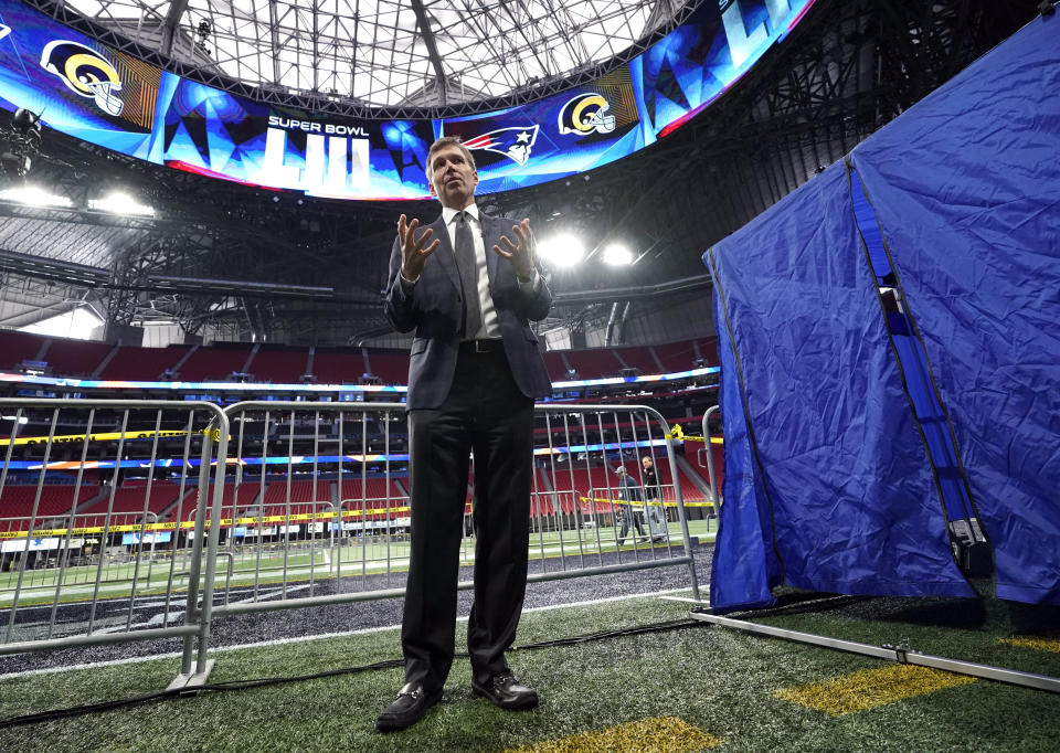 FILE - In this Tuesday, Jan. 29, 2019 file photo, NFL Chief Medical Officer Dr. Allen Sills explains what takes place inside a sideline injury tent, right, during a health and safety tour at Mercedes-Benz Stadium for the NFL Super Bowl 53 football game in Atlanta. Everyone who has watched an NFL player disappear into that medical tent on a sideline has an idea of what happens once the flap folds down. The NFL shares a look Tuesday, Jan. 28, 2020 inside the tent and game-day procedures designed to help when someone is hurt. (AP Photo/David J. Phillip, File)