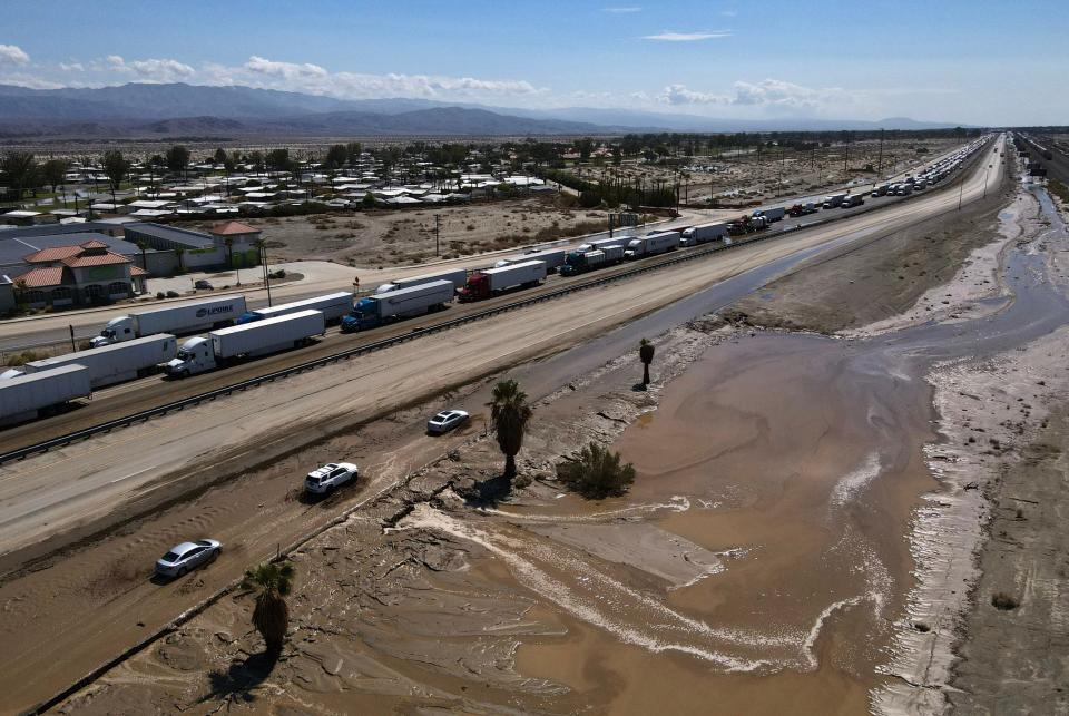 Westbound Interstate 10 traffic is snarled near the Monterey exit in Palm Desert Aug. 21, 2023 because of rain and mud that flowed over the interstate in both directions a day earlier from Tropical Storm Hilary.