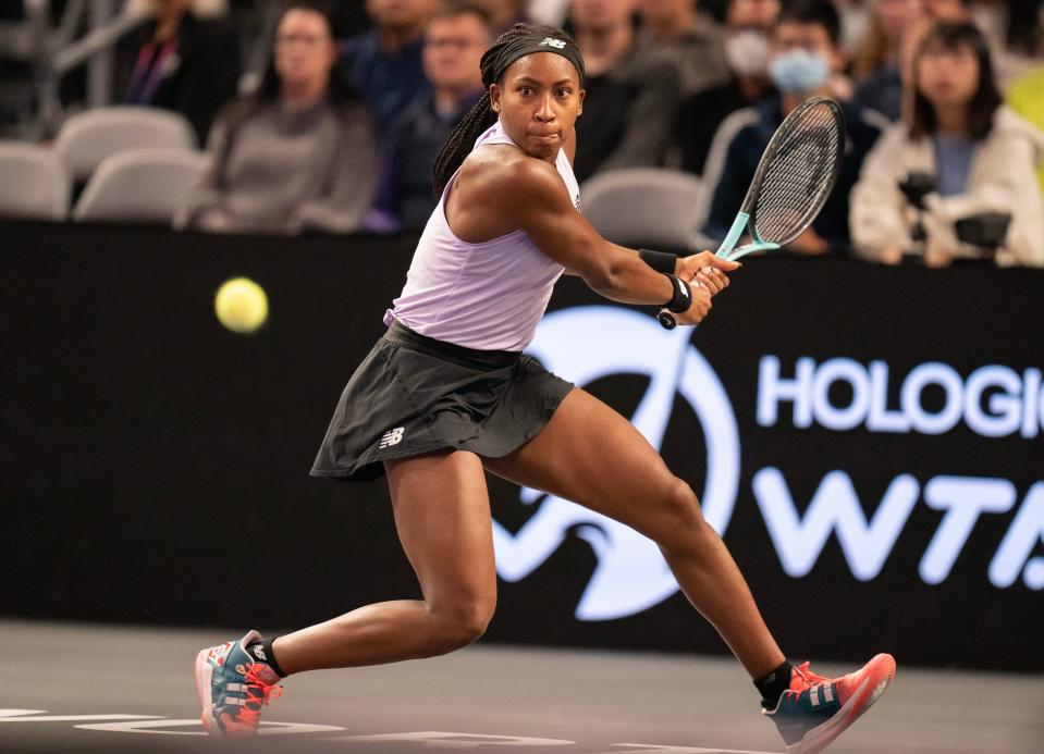 Coco Gauff returns a shot against Iga Swiatek during a Nov. 5 match at the 2022 WTA Finals.