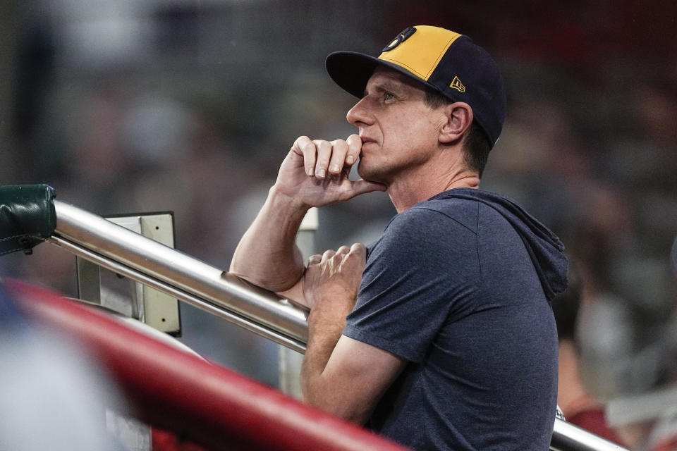 FILE -Milwaukee Brewers manager Craig Counsell watches from the dugout in the fourth inning of a baseball game against the Atlanta Braves, Friday, July 28, 2023, in Atlanta. The first sign of discontent regarding Craig Counsell’s decision to leave the Milwaukee Brewers to manage the Chicago Cubs appeared in his hometown at the Little League field that bears his name.((AP Photo/John Bazemore, File)