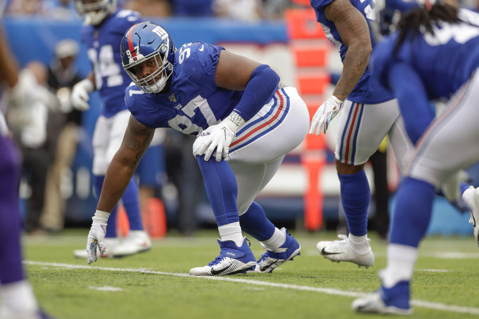 FILE - In this Oct. 6, 2019, file photo, New York Giants defensive tackle Dexter Lawrence (97) waits for the snap against the Minnesota Vikings during the third quarter of an NFL football game, in East Rutherford, N.J. The second of three Giants’ first-round draft picks in 2019 wants to be noticed in the fourth quarter of games this season. (AP Photo/Adam Hunger, File)