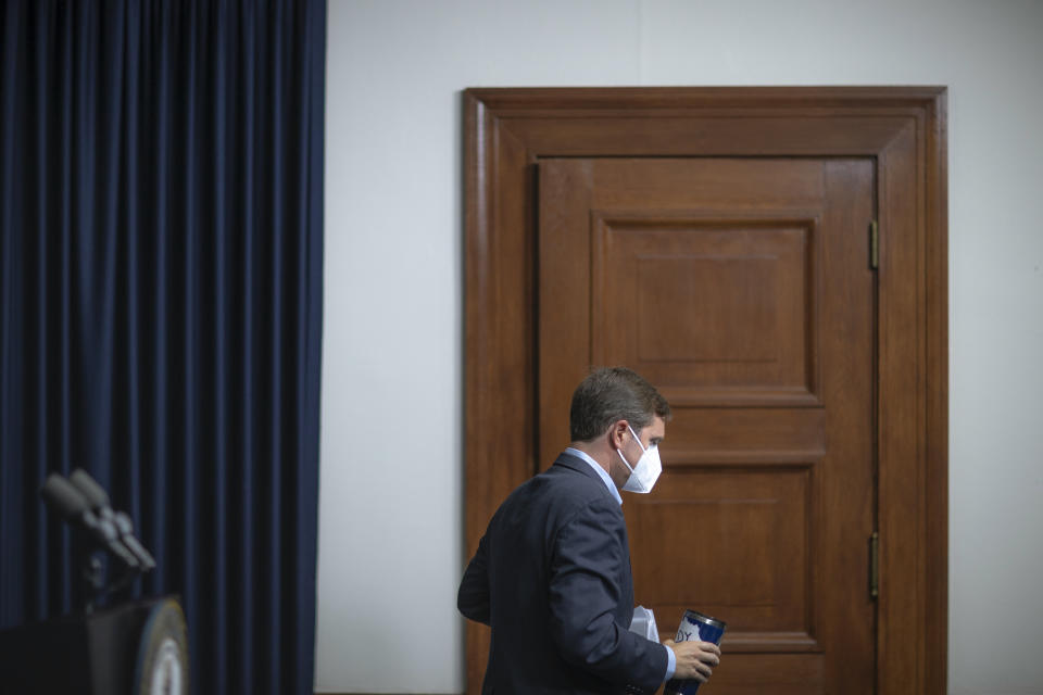 Kentucky Gov. Andy Beshear walks away from a podium after delivering a media briefing about the COVID-19 pandemic at the state Capitol in Frankfort, Ky., on Monday, Aug. 23, 2021. (Ryan C. Hermens/Lexington Herald-Leader via AP)